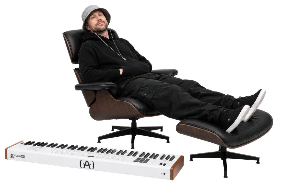 HAM GORDON SEATED BESIDE A PIANO KEYBOARD